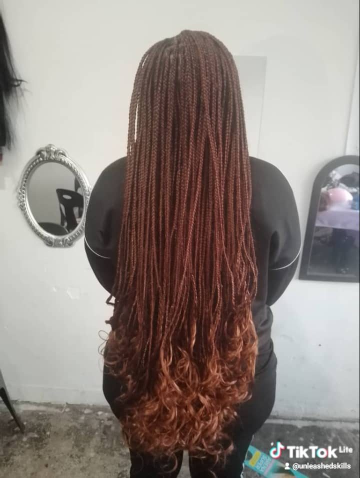 Curly auburn braids, front view