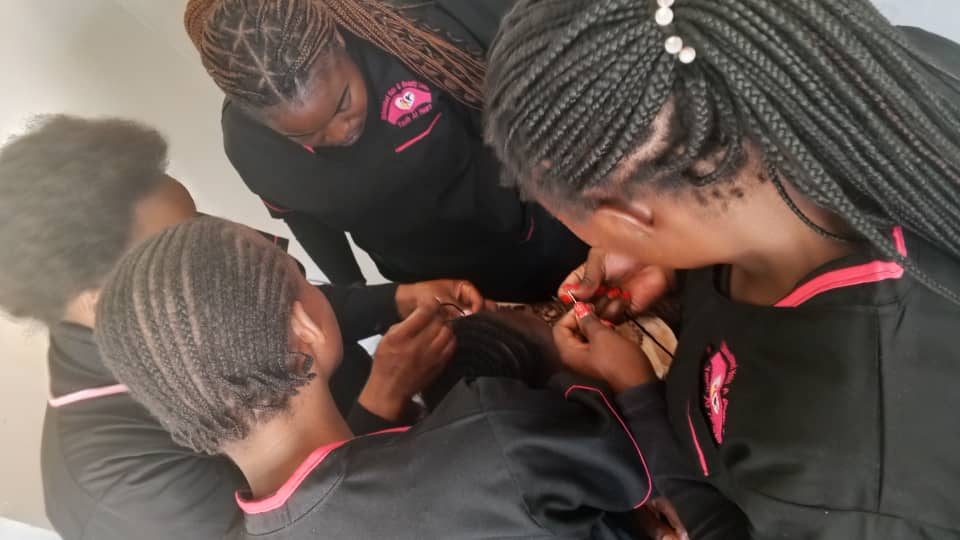 Trainees practising lash technique
