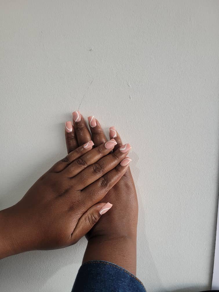 Nude manicure with white swirl accent