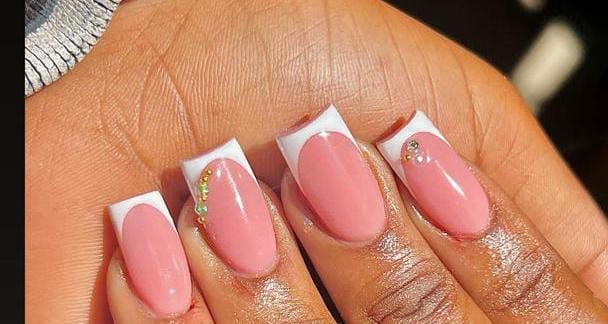Pink French manicure with crystal accents