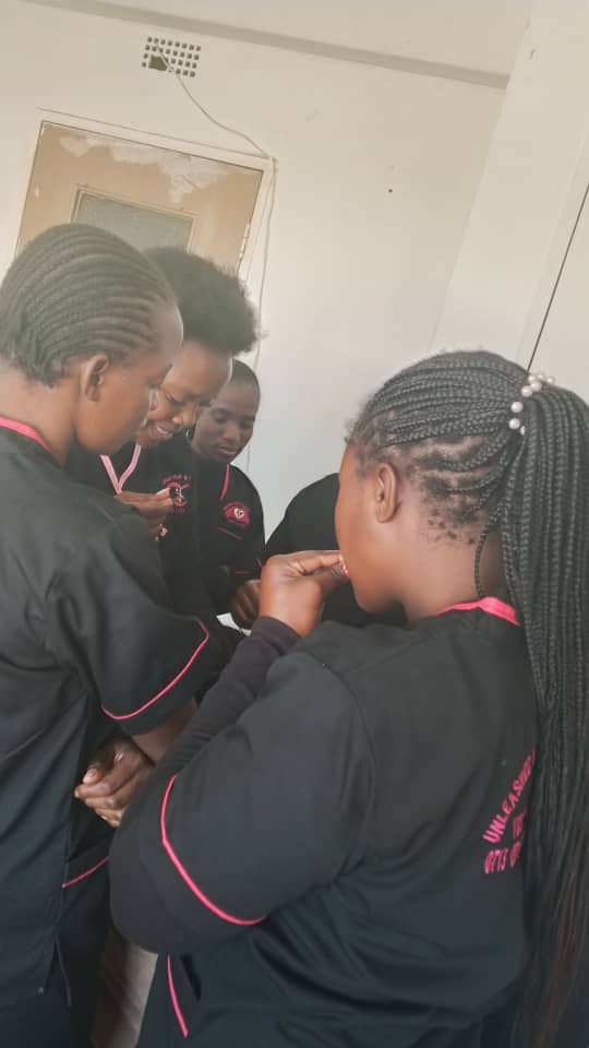Trainees working together during a practical session