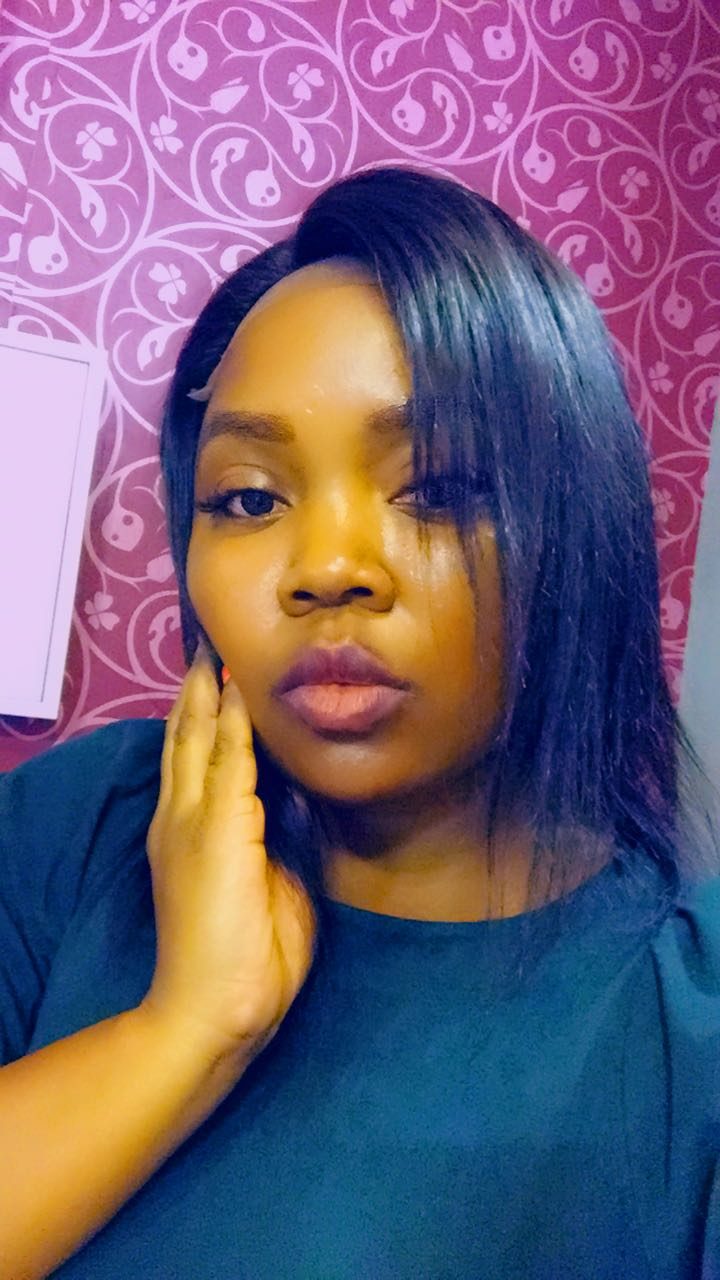 Client wearing a sleek straight bob wig