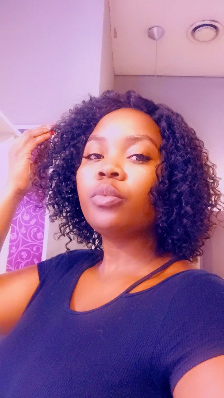 Client wearing a curly bob wig